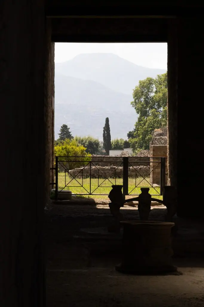 view from dark interior to sunny landscape with mountains