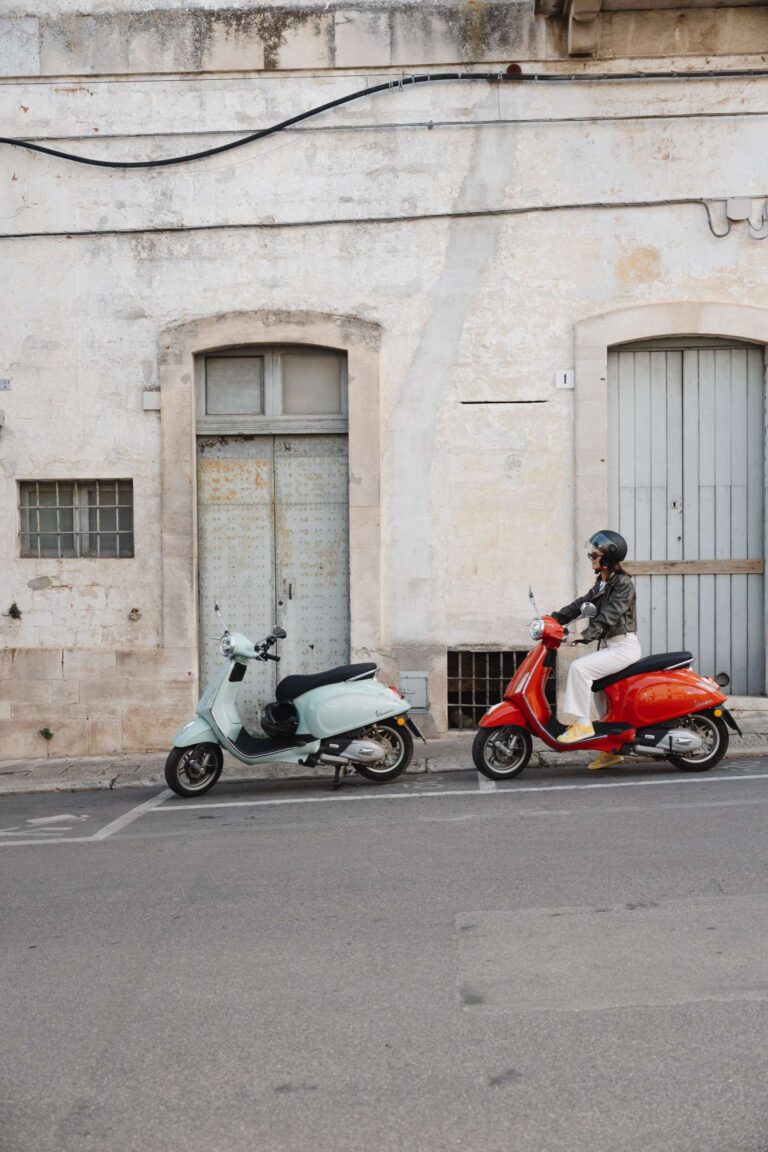 two vespas woman on vespa